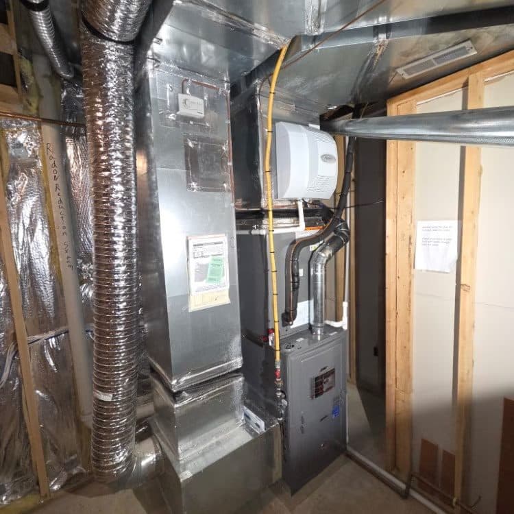 Basement air handler with insulated flex duct and new gas piping during finishing work